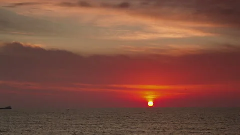 Loopable video of clouds moving in sky at sunset over Mediterranean sea Stock Footage 143035414