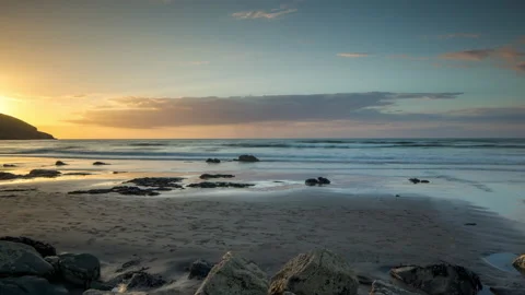 Loopable video of clouds moving in sky at sunset over a beach Stock Footage 143035484