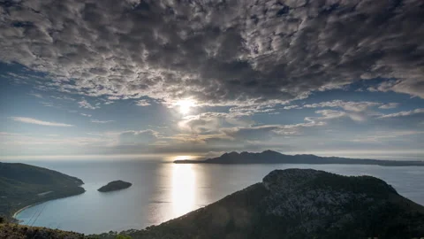 Loopable video of clouds moving in sky at sunrise in the mediterranean Stock Footage 152145574