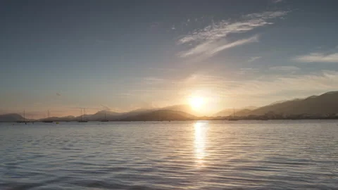 Loopable video of sun and clouds moving in sky over Mediterranean sea Stock Footage 132428016