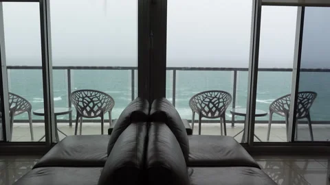Loopable wide angle view of ocean from apartment, stormy day Stock Footage 329365275