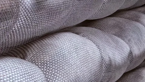 Looped 3D close-up of smart material morphing from gold plate into soft Stock Footage 316225589