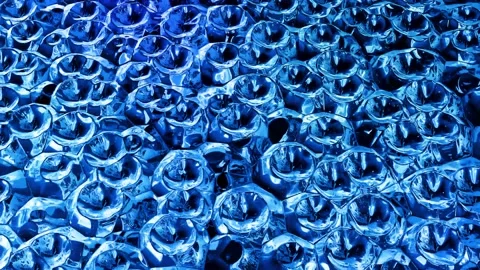 Looped abstract liquid background with wavy sparkling pattern on shiny glossy Stock Footage 141684374