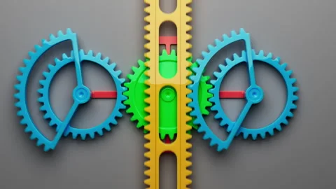 Looped animation of a group of multi-colored children plastic gears. Stock Footage 273921636