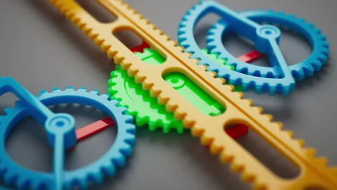 Looped animation of a group of multi-colored children plastic gears. Stock Footage 273923049