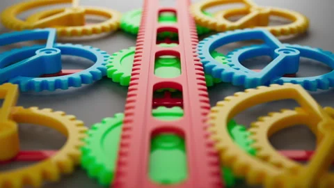 Looped animation of a group of multi-colored children plastic gears. 스톡 동영상 273926148