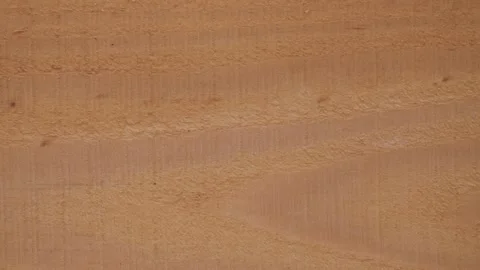 Looped frame-by-frame animation of a textured wood background.  Stock Footage 263429510