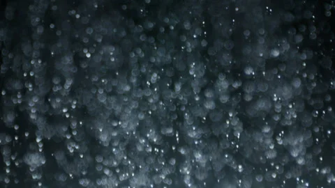 Looped Macro High-Speed Side Plate Shot Water Downpour on Black Selective Focus Video stock 138610444