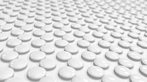 A looped a motion tween white round tablets Stock Footage 60711847