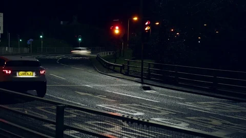 Looped Night time traffic time lapse at motorway roundabout 動画素材 72669637