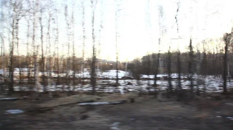 Looped View from window of high-speed train at the village, forest at winter Stock Footage 35917212