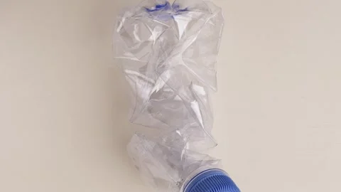 Looping 360-Degree Rotation One crushed plastic bottle Stockbeeldmateriaal 318164590