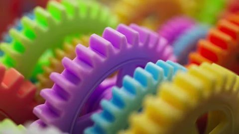 Looping 3D animation multi-colored plastic toy gears. Stock Footage 272769010