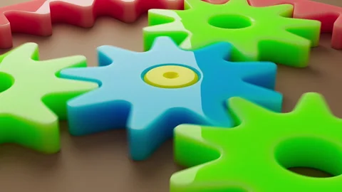 Looping 3D animation multi-colored plastic toy gears. Stock Footage 276431459