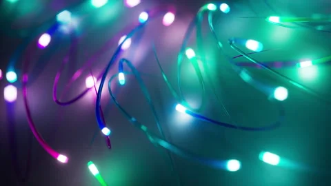 Looping 3D animation of neon multicolor glowing lines moving in space Stock Footage 274442049