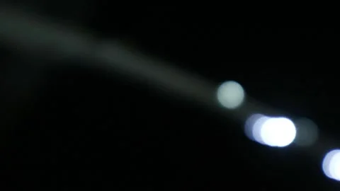 Looping abstract background with blurred white and red lights on black backdrop Stock Footage 341410096