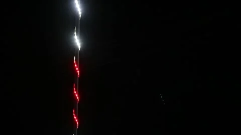 Looping abstract background with blurred white and red lights on black backdrop Stock Footage 341410403