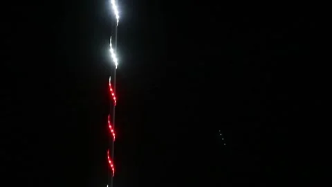 Looping abstract background with blurred white and red lights on black backdrop Stock Footage 341410823
