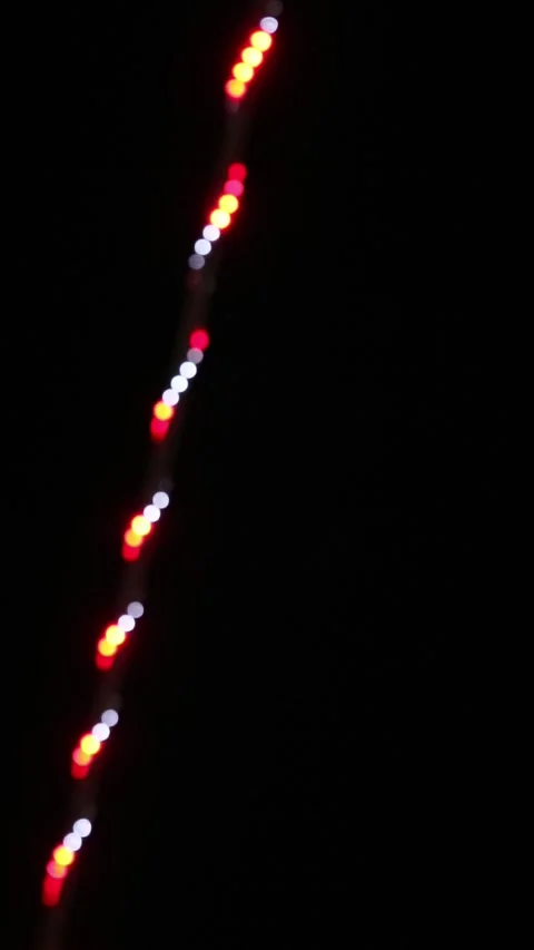 Looping abstract background with blurred white and red lights on black backdrop Stock Footage 341441772