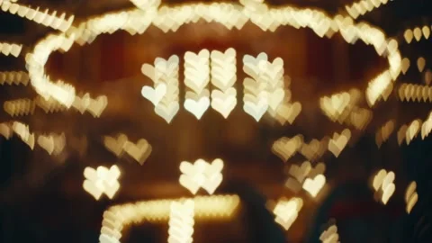Looping abstraction of defocused bright lights in the shape of a heart Stock Footage 231735069