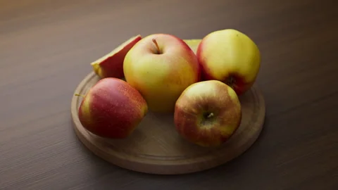 Looping animation around a composition of apples lying on a wooden board. Video stock 312108341