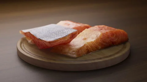Looping animation around a composition of salmon lying on a wooden board. Stock Footage 310795260