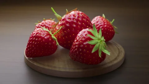 Looping animation around a composition of strawberry lying on a wooden board. Stock Footage 308743562