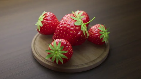 Looping animation around a composition of strawberry lying on a wooden board. Stock Footage 309335994