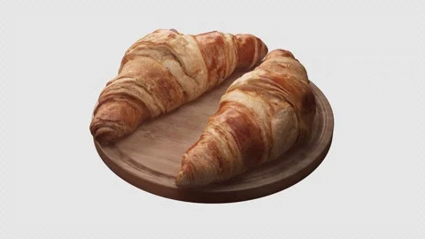 Looping animation around a composition of two croissants lying on a wooden board Stock Footage 314043570