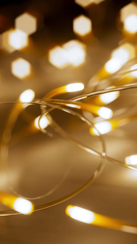 Looping animation of glowing neon lines in motion with soft bokeh background. Video stock 314837025