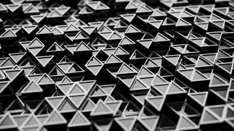 Looping animation of a group of black plastic triangular geometric shapes. Stock Footage 276443787