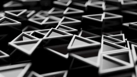 Looping animation of a group of black plastic triangular geometric shapes. Stock Footage 276444016