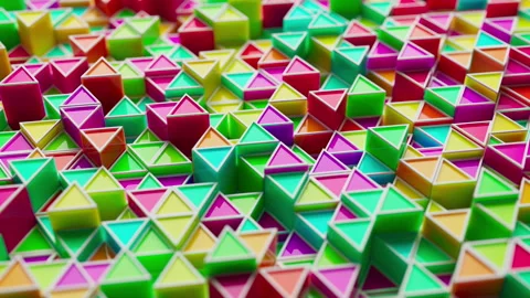 Looping animation of a group of multicolored plastic geometric shapes. Stock Footage 276442934