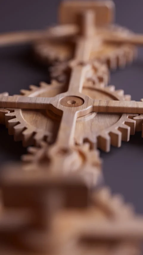 Looping animation of a mechanical construction made of wooden gears. Stock Footage 308739969