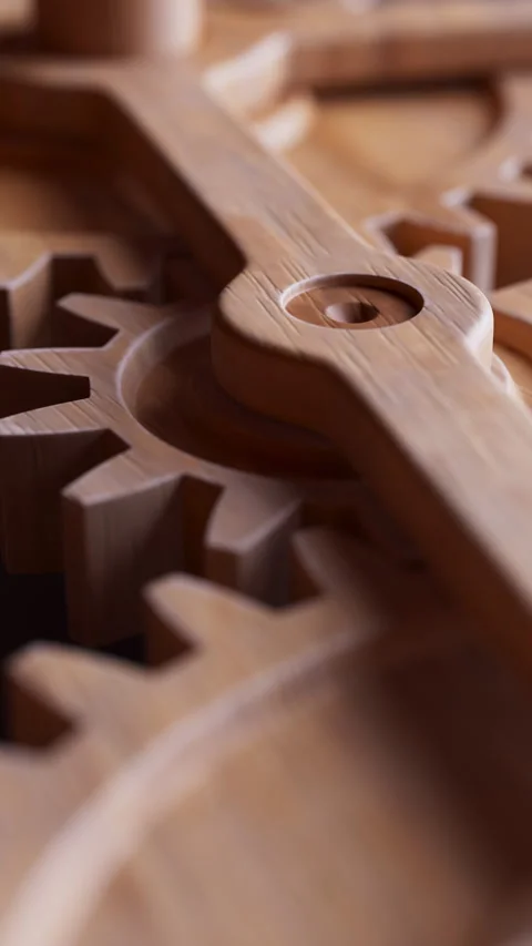 Looping animation of a mechanical construction made of wooden gears. Stock Footage 308739981