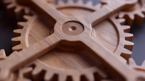 Looping animation of a mechanical construction made of wooden gears. Stock Footage 309334761