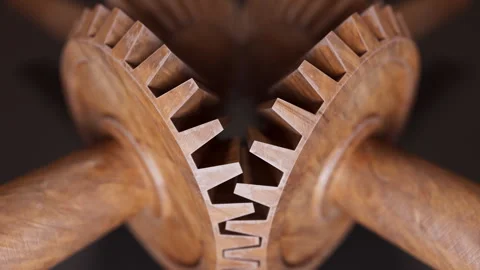 Looping animation of a mechanical construction made of wooden gears. Stock Footage 309334859