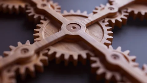 Looping animation of a mechanical construction made of wooden gears. Video stock 310794492