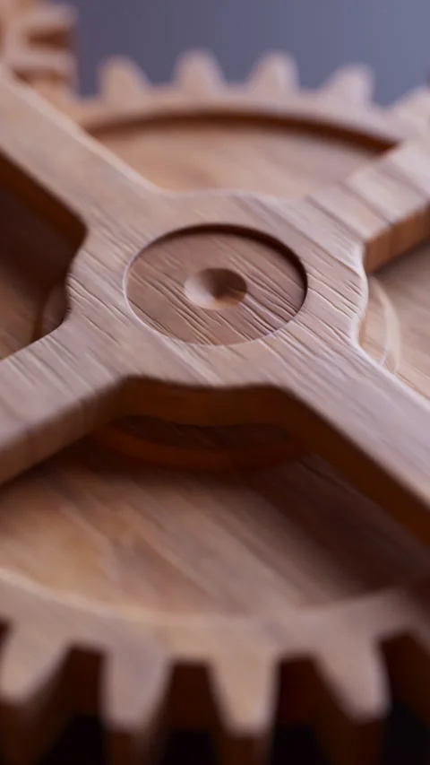 Looping animation of a mechanical construction made of wooden gears. Stock Footage 310794555