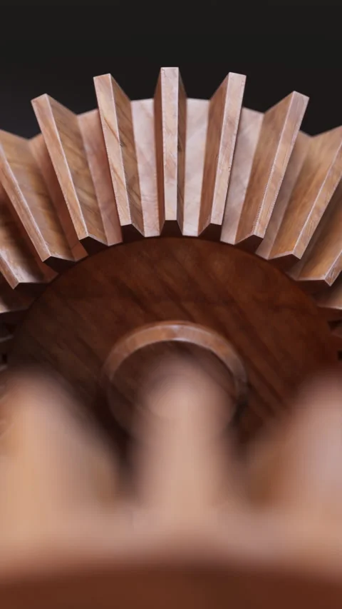 Looping animation of a mechanical construction made of wooden gears. Stock Footage 310794636