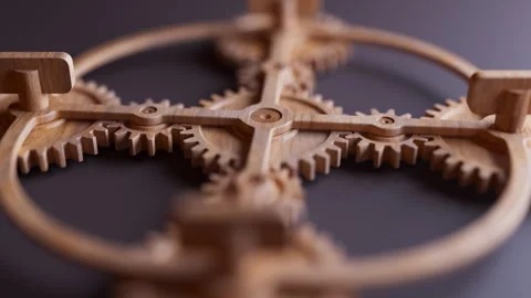 Looping animation of a mechanical construction made of wooden gears. Stock Footage 312576697