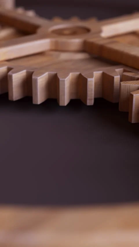 Looping animation of a mechanical construction made of wooden gears. Stock Footage 313288844