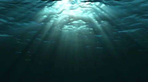 Looping animation of ocean waves from underwater. Light rays shining through. Stock Footage 49864591