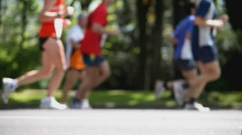 Looping blurred marathon runners from side Stock Footage 370442