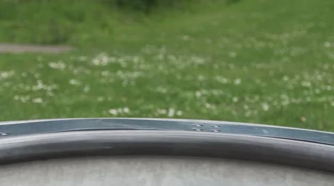 Looping clip of child boy playing on roundabout in play park Stock Footage 67204493