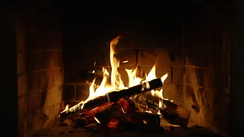 A Looping Clip of a Fireplace with Medium Size Flames Burning Fire Slow Motion Video stock 223643116