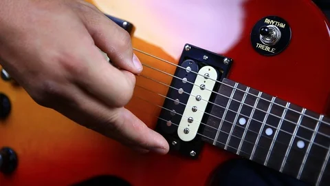 Looping clip of man picking melody on electric guitar close up Stock Footage 96722936