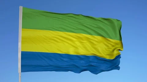 Looping flag for Gabon on flag pole, blowing beautifully in the wind. Includes Stock Footage 79765826