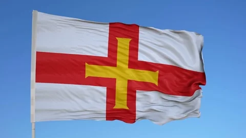Looping flag for Guernsey on flag pole, blowing beautifully in the wind. Stock Footage 79775710