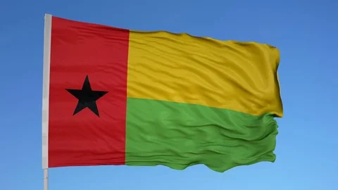 Looping flag for Guinea on flag pole, blowing beautifully in the wind. Includes Stock Footage 79772619